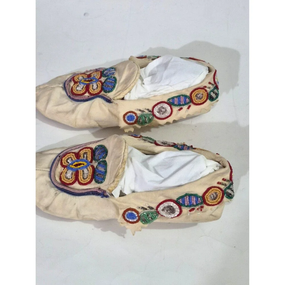Vintage Crow Beaded Hide Moccasins featuring Intricate Colorful Glass Beadwork